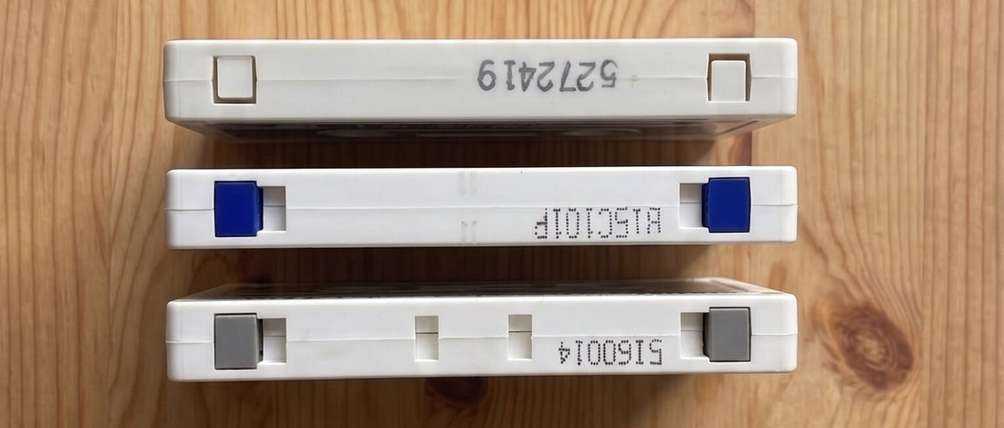 Three cassette shells in a row showing Type I, II, and IV high bias notch differences